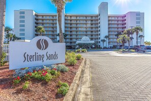 A hotel entrance with a sign reading "Sterling Sands".