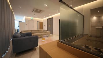 Rooftop Party Room | Down comforters, desk, blackout drapes, soundproofing
