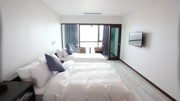 Habitación Deluxe con 2 camas individuales | Artículos del minibar gratis, cortinas blackout y wifi gratis