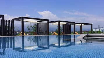 Seasonal outdoor pool, pool umbrellas, pool loungers