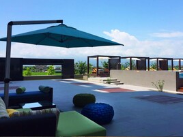 Seasonal outdoor pool, pool umbrellas, pool loungers