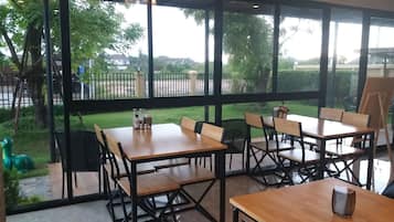 Breakfast, lunch, dinner served; international cuisine, garden views