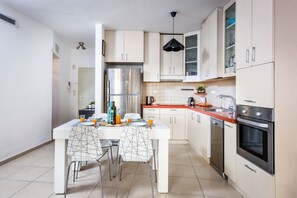 Apartment, 2 Bedrooms | Private kitchen | Full-size fridge, microwave, oven, stovetop