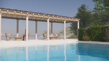 Alberca al aire libre por temporada y sombrillas en la alberca