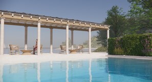 Een seizoensgebonden buitenzwembad en parasols bij het zwembad