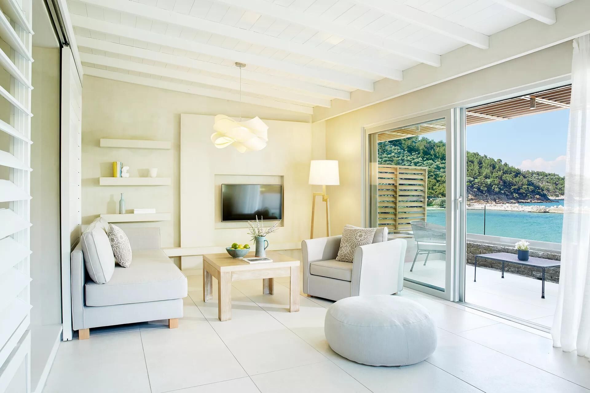 Deluxe Suite | Living area | 50-inch flat-screen TV with satellite channels, TV