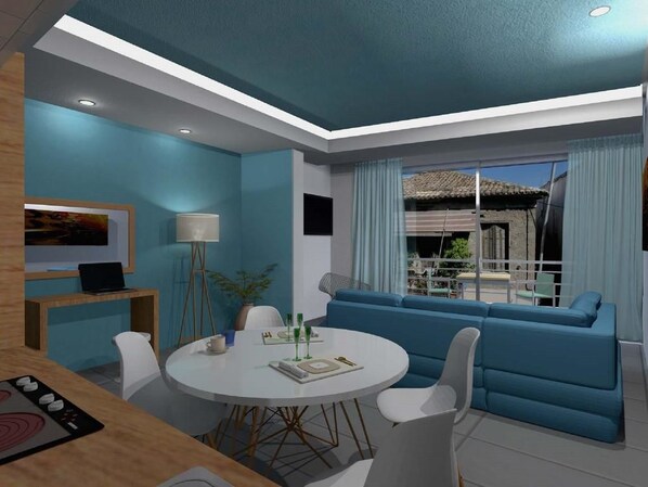 Una sala de estar moderna con una mesa de comedor redonda, sofá azul y vistas al exterior.