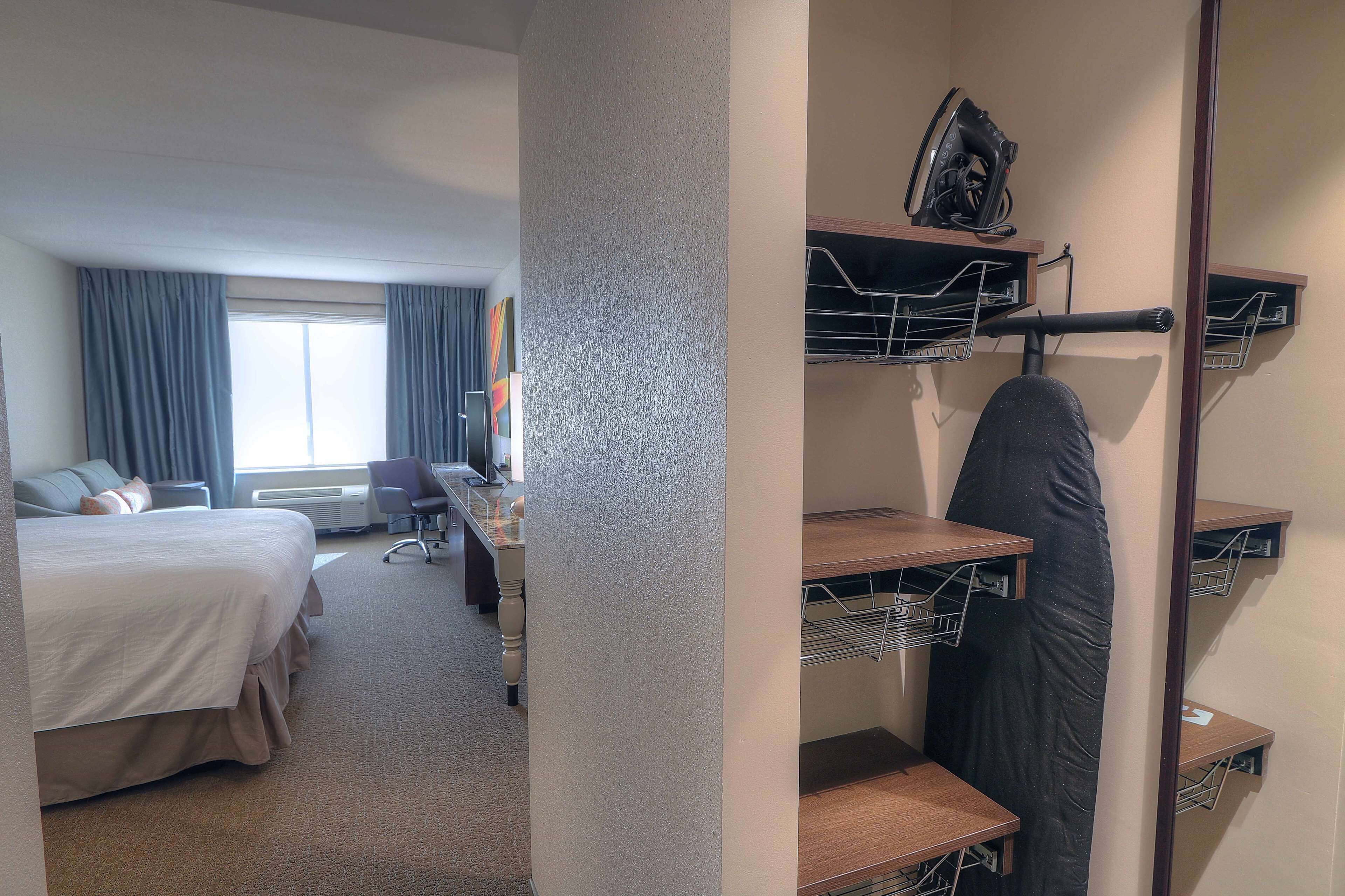 Desk, laptop workspace, blackout drapes, iron/ironing board