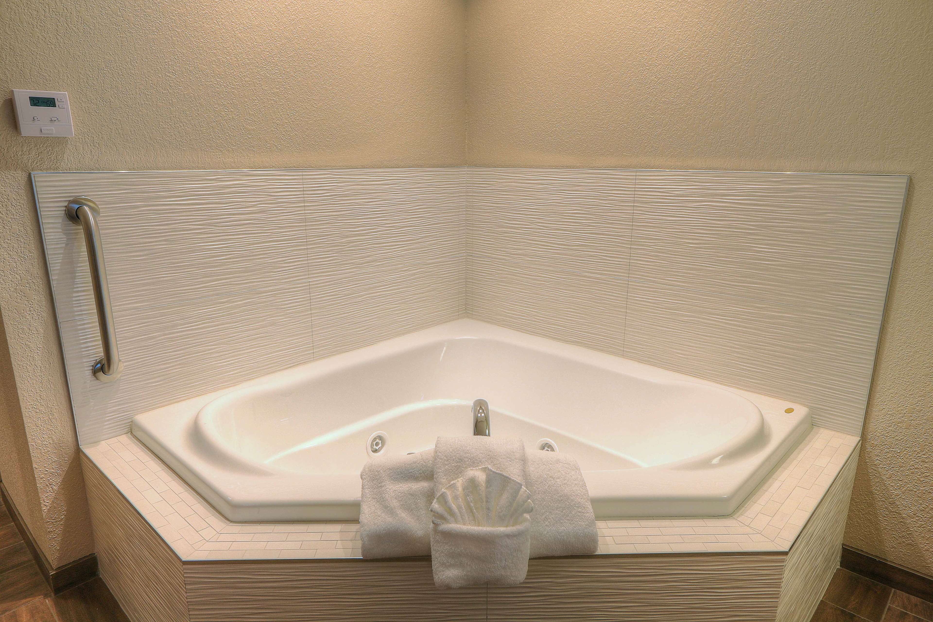 room, 1 king bed, jetted tub (balcony) | bathroom | free toiletries, hair dryer, towels, soap