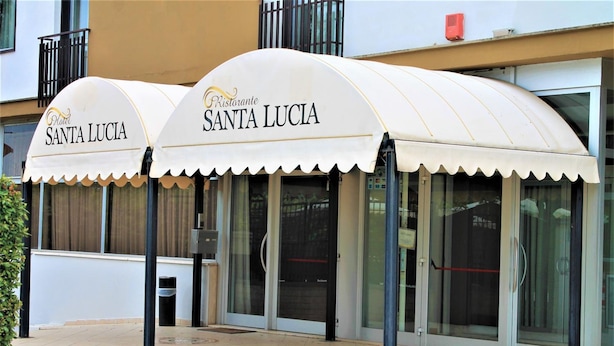 A restaurant named Santa Lucia with a white awning and glass doors. - Hotel Santa Lucia (Bastia Umbra)