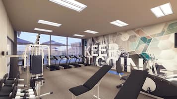A modern gym with exercise equipment, large windows, and a geometric wall mural.