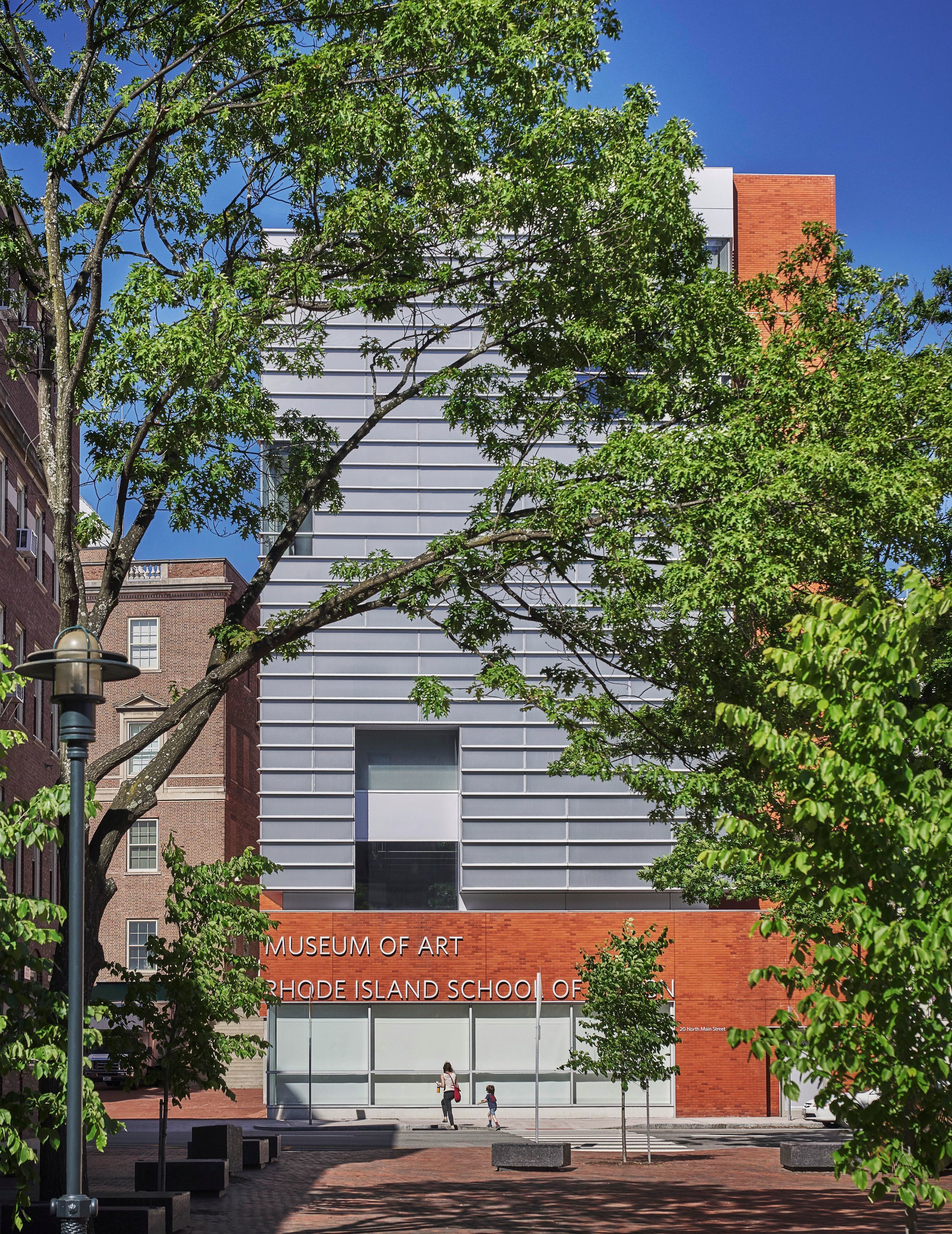 A modern building with a mix of brick and metal siding, labeled as the Museum of Art at Rhode Island School of Design.