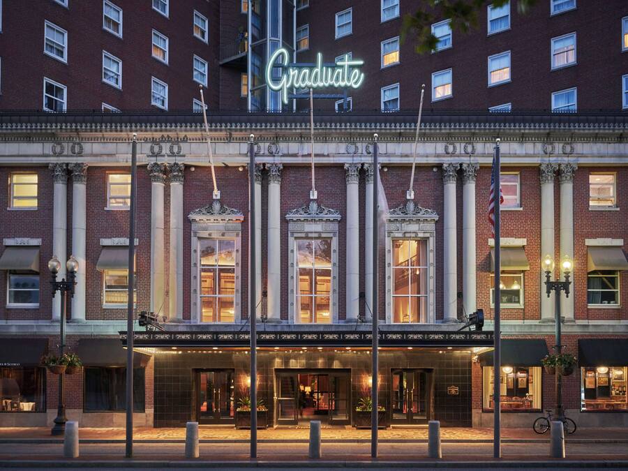 A hotel with a prominent 'Graduate' sign, large columns, and a classic facade.