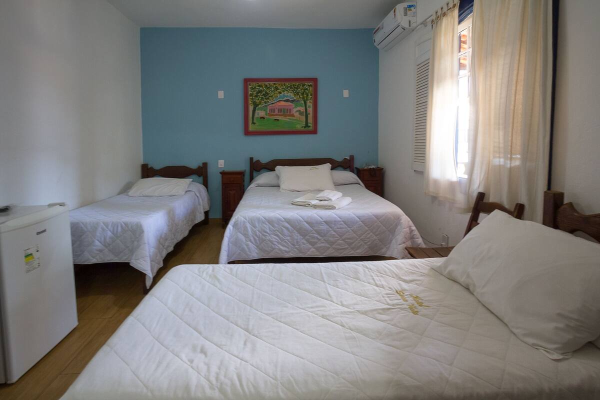 Standard Quadruple Room | Minibar, desk, blackout drapes, iron/ironing board (on request)