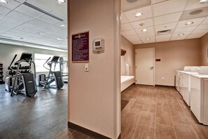 A gym with exercise equipment and a sign on the wall. - Home2 Suites by Hilton Springfield North (Springfield)