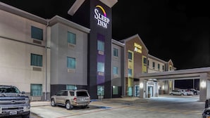 A Sleep Inn hotel with a modern facade, multiple parking spaces, and a MainStreet Subs sign. - MainStay Suites Big Spring North I-20 (Big Spring)