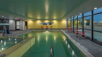 Indoor pool, open 9:00 AM to 9:00 PM, pool loungers