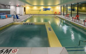 Indoor pool, open 9:00 AM to 9:00 PM, pool loungers