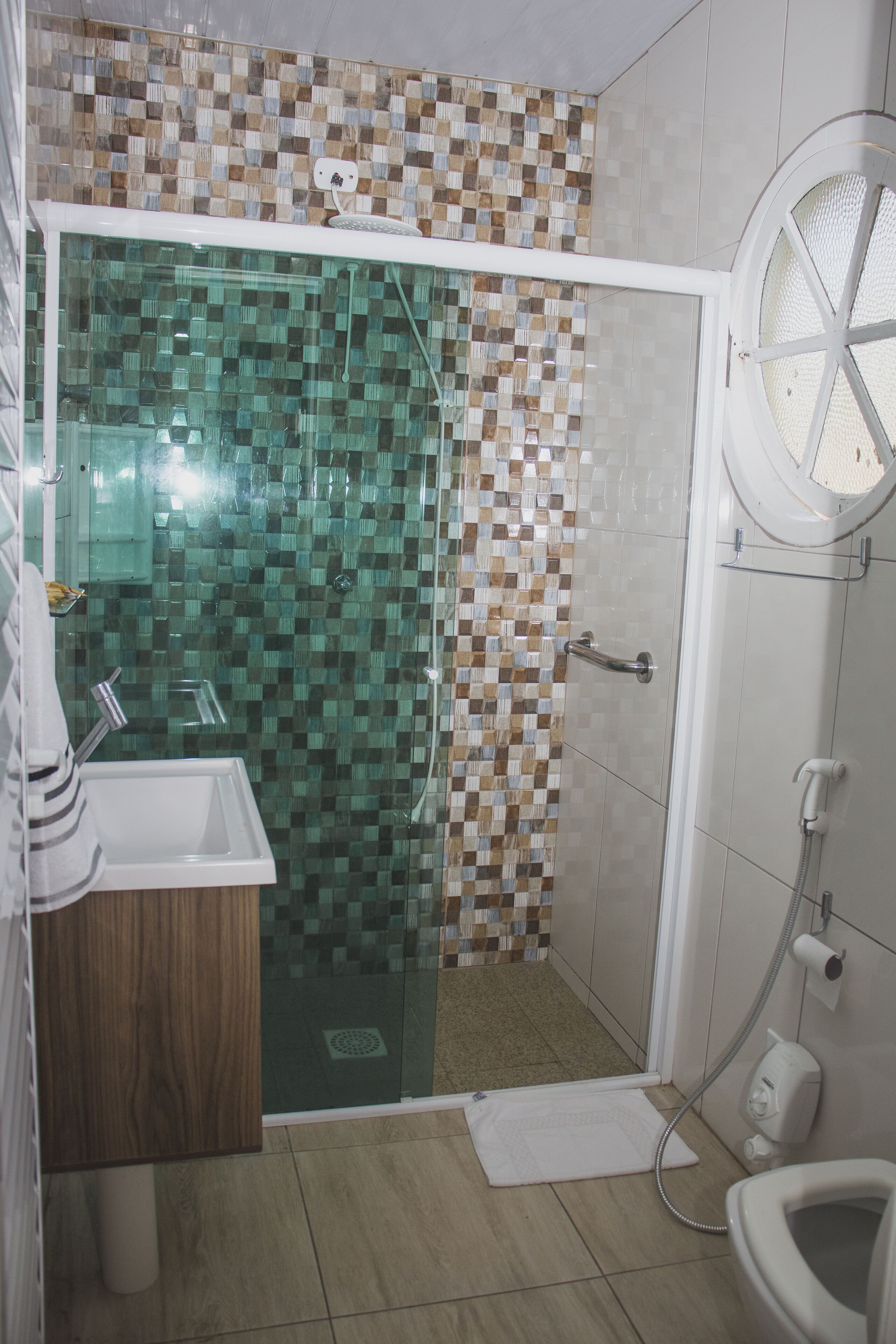 luxury studio suite, sea view | bathroom | shower, free toiletries, hair dryer, towels