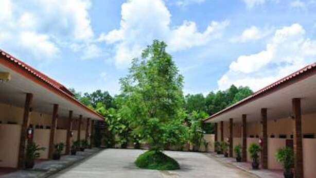 A building with a central courtyard, surrounded by covered walkways.