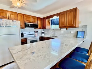 Fridge, microwave, oven, stovetop - Sunset Beach "A4" - Beachfront, Pool/Ocean View, Kayaks, Bikes, & More! 🏖 (San Pedro Town)