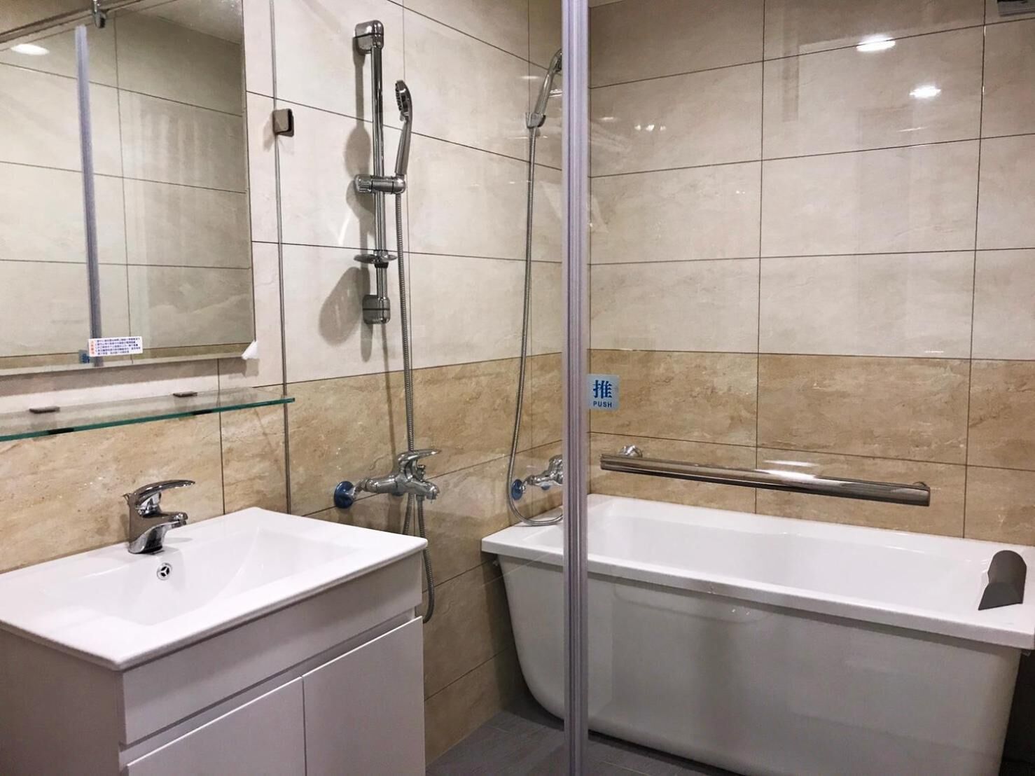 shower, hair dryer, slippers, towels