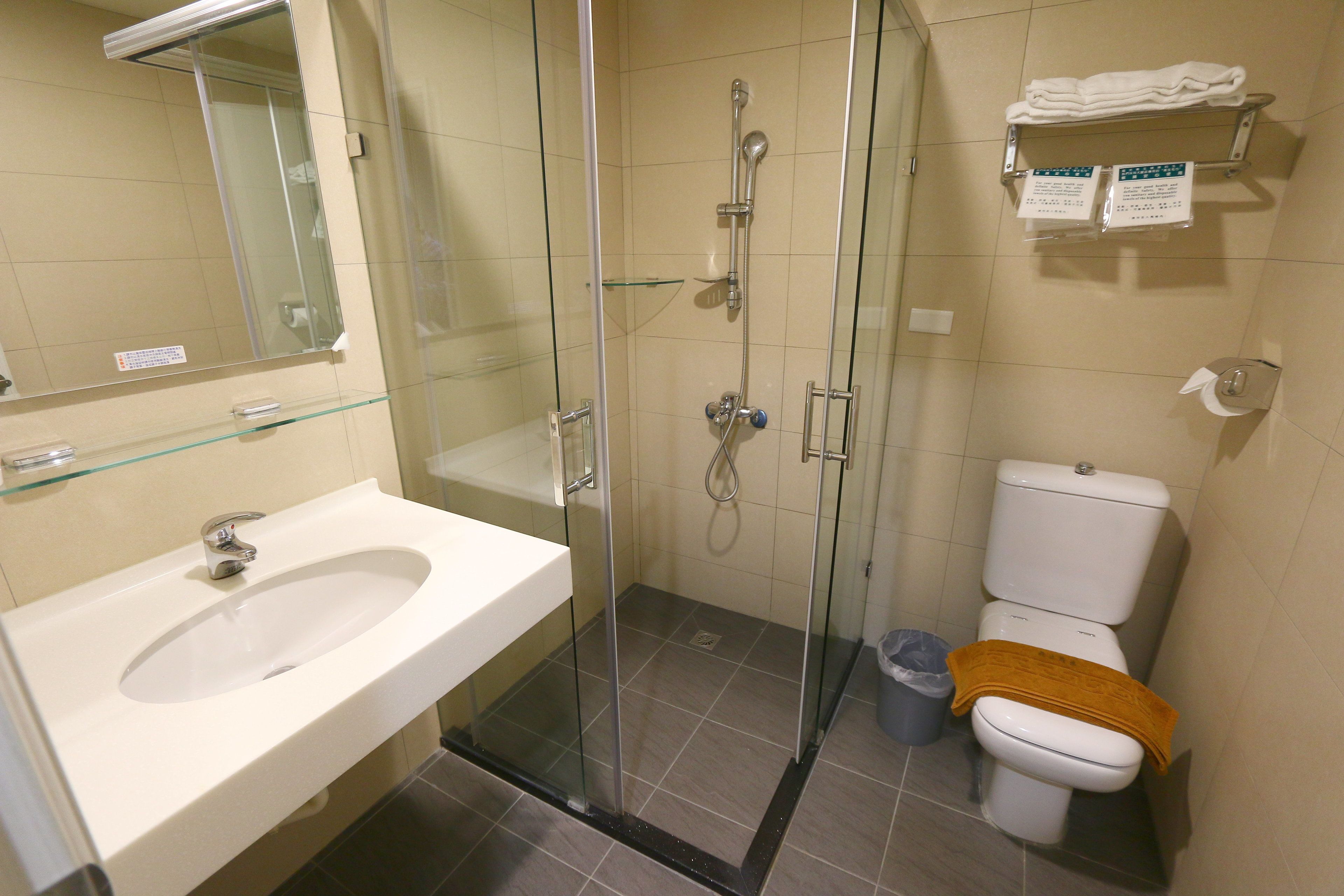 shower, hair dryer, slippers, towels