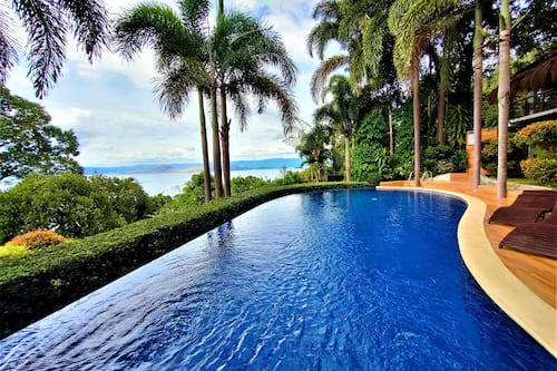 Outdoor pool, open 6 AM to 10 PM, pool umbrellas, sun loungers