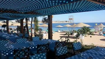 Sun-loungers, beach umbrellas, beach towels, scuba diving