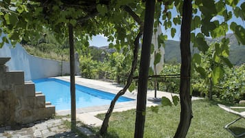 Seasonal outdoor pool, open 9:30 AM to 7:30 PM, pool umbrellas
