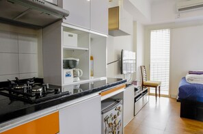 Exclusive Apartment, Mountain View | Private kitchen | Fridge, stovetop, cookware/dishes/utensils - FrescoBett at Margonda Residence Depok (Depok)