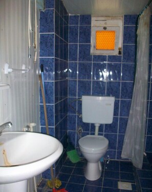 Separate bathtub and shower, deep-soaking bathtub, slippers, towels