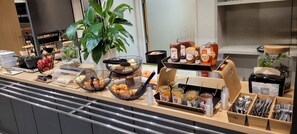 A breakfast buffet with various food items, condiments, and utensils. - B&B HOTEL CHARTRES Océane (Chartres)