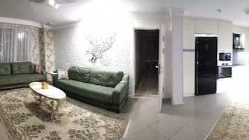 Comfort Apartment, Sea View | Living room | Flat-screen TV, heated floors