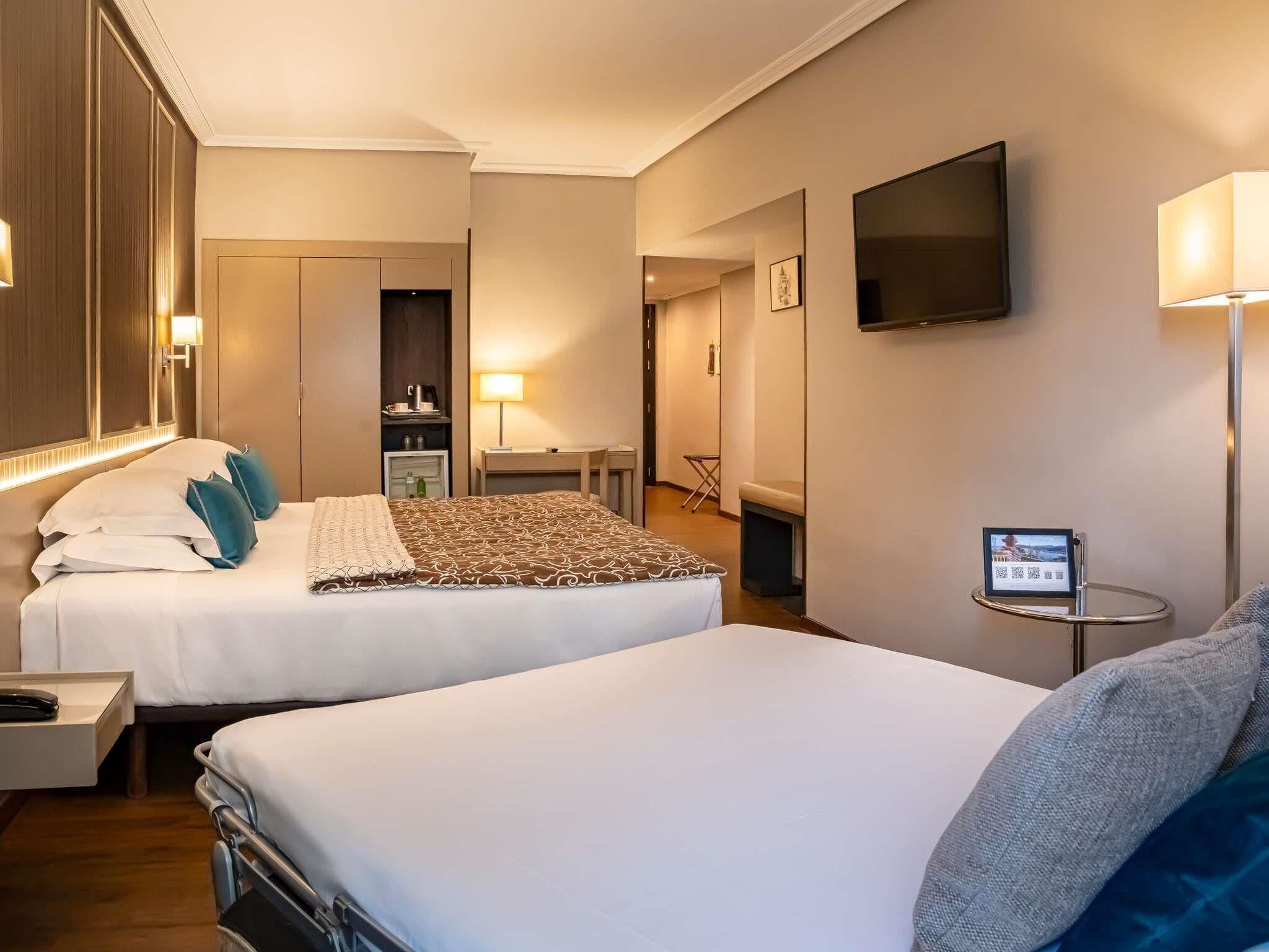 Standard Twin Room, With Sofa Bed, Mountain View | Minibar, in-room safe, desk, blackout drapes