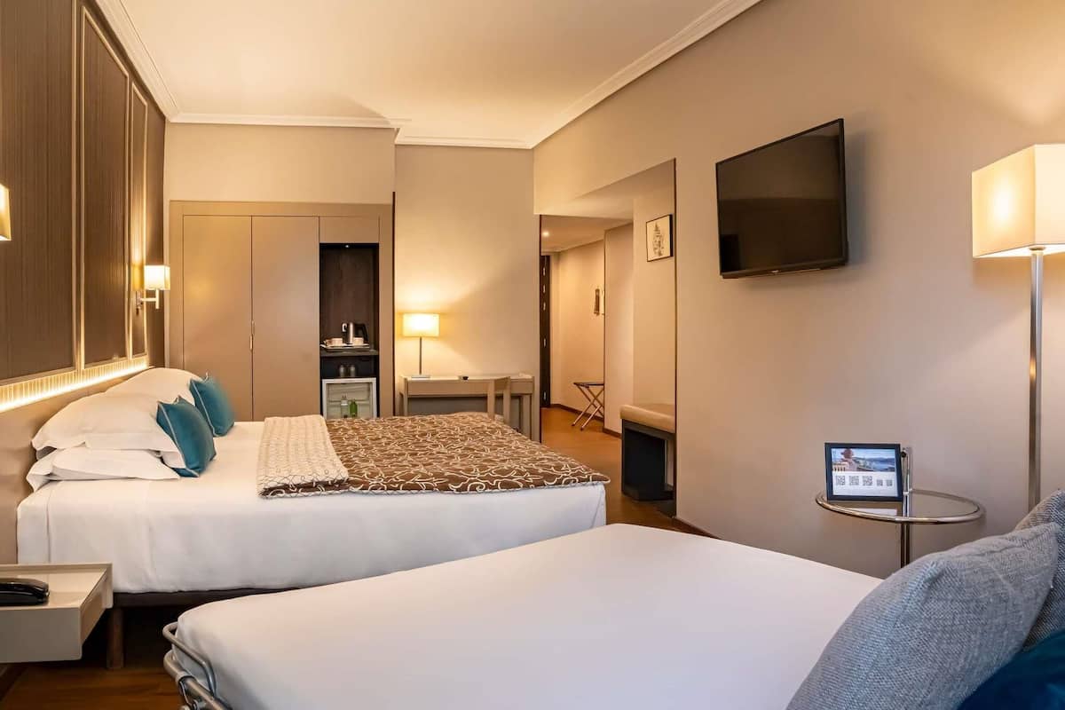 Standard Twin Room, With Sofa Bed, Mountain View | Minibar, in-room safe, desk, blackout drapes