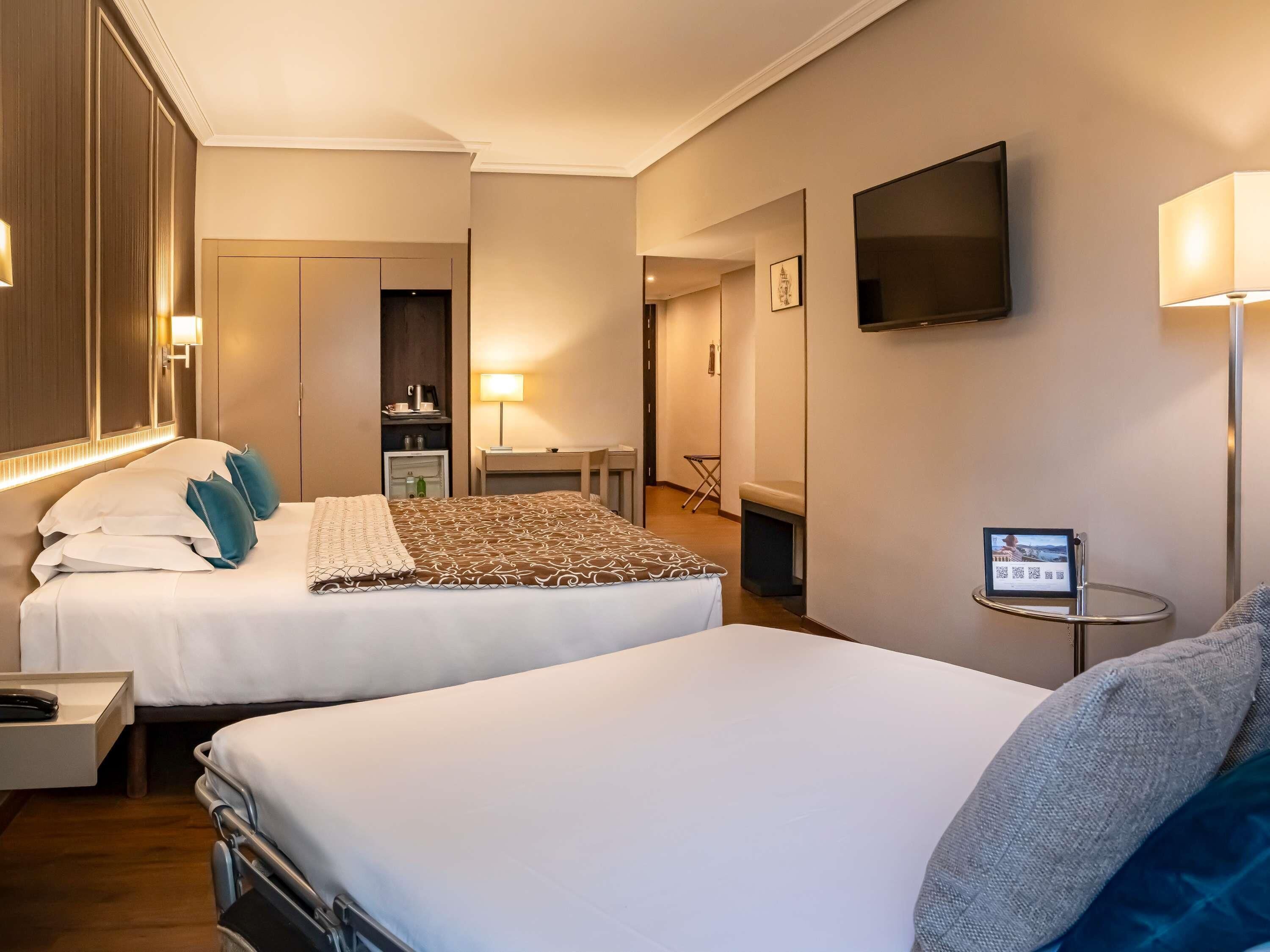 Standard Twin Room, With Sofa Bed, Mountain View | Minibar, in-room safe, desk, blackout drapes