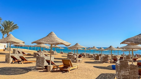 On the beach, sun loungers, beach umbrellas, beach towels