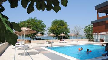 Outdoor pool, pool umbrellas, pool loungers