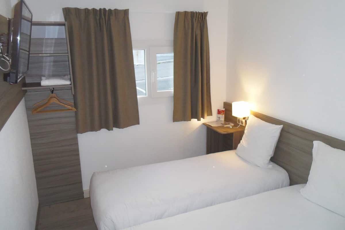 twin room | desk, blackout curtains, soundproofing, iron/ironing board