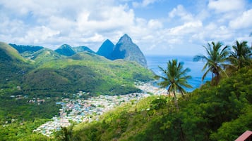 A coastal town with a view of the ocean and mountains.