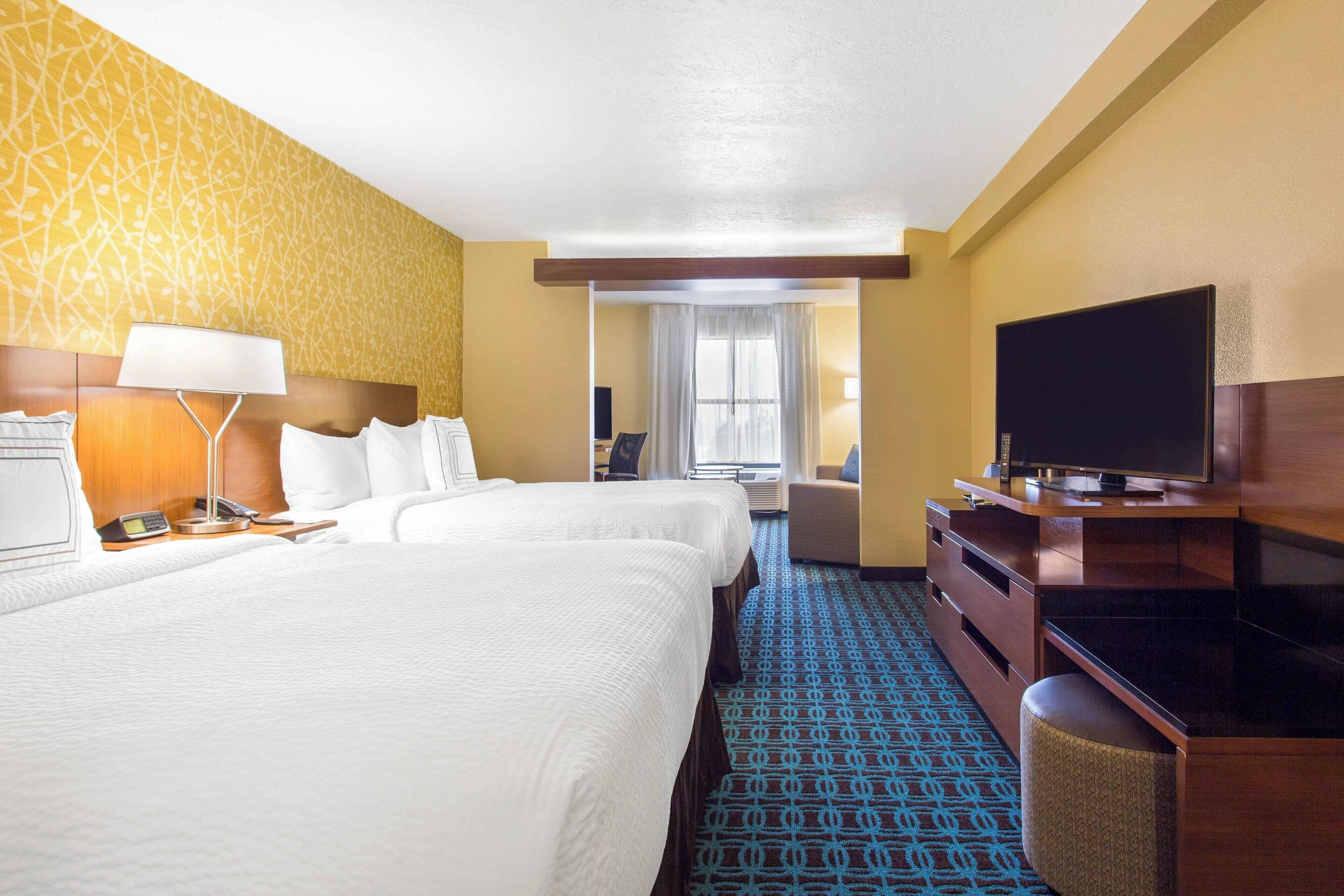 suite, multiple beds | in-room safe, desk, blackout curtains, iron/ironing board