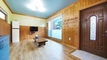 Condo (Dasol) | Living area | Flat-screen TV