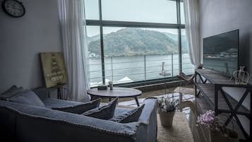 Standard Loft, Non Smoking, River View (SS IV) | Living area | Flat-screen TV, pay movies