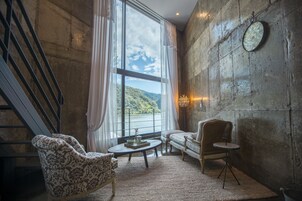 Deluxe Loft, 1 King Bed, Non Smoking, River View (SS V) | Living area | Flat-screen TV, pay movies