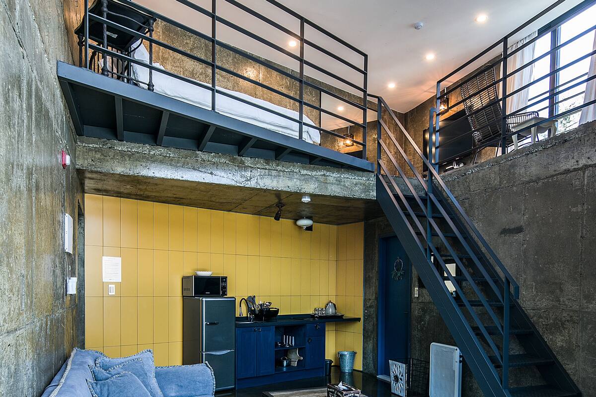 deluxe loft, non smoking, river view (ss vi) | living area | flat-screen tv, pay films