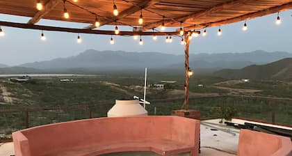 Panoramic mountain and ocean views just outside of town. Quiet, serene , solar.