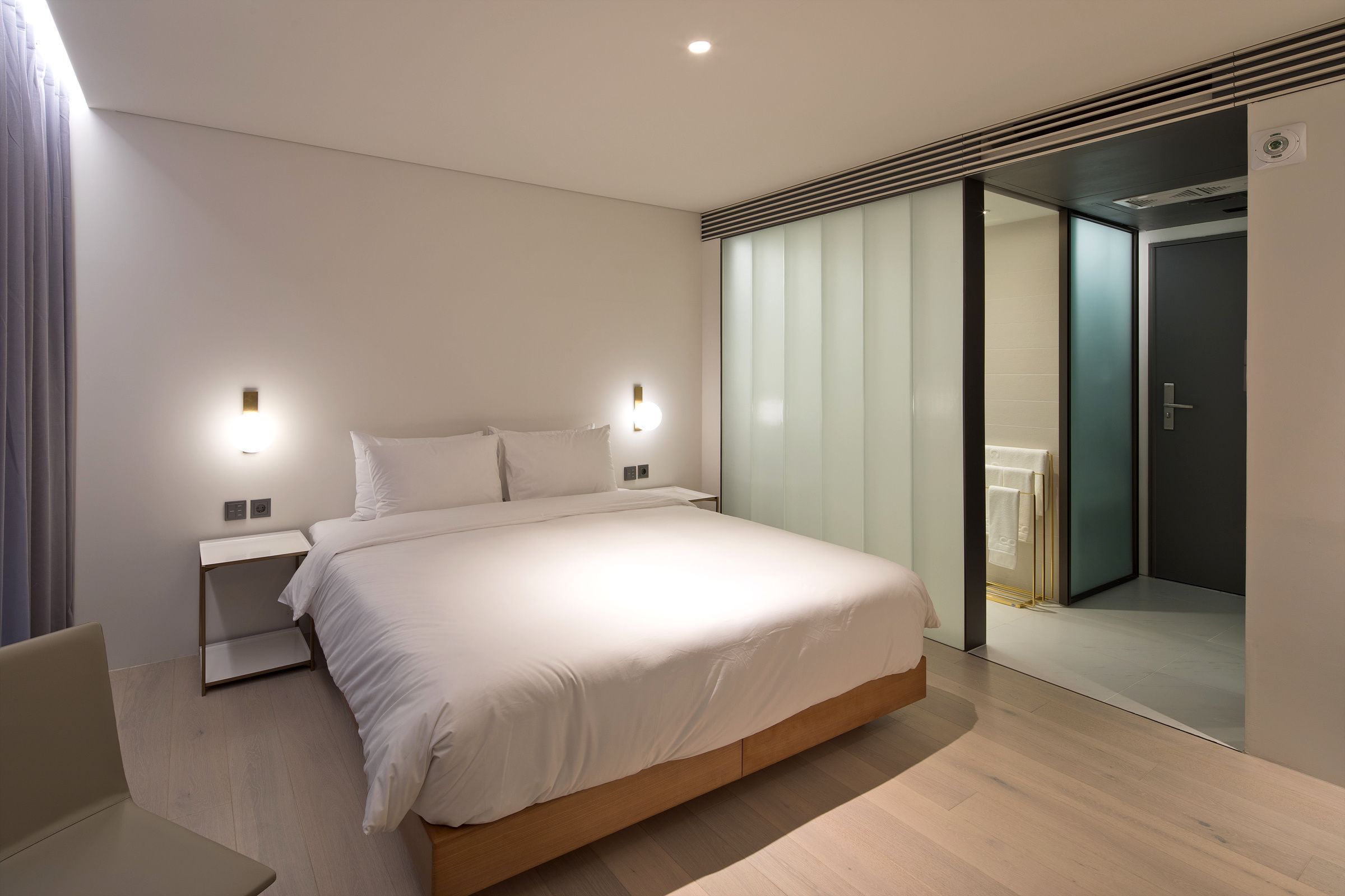 premium bedding, down duvets, memory-foam beds, in-room safe