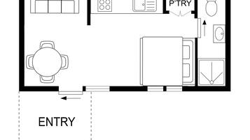 A floor plan of a hotel room with a bed, a desk, a chair, a small table, a wardrobe, and a bathroom.