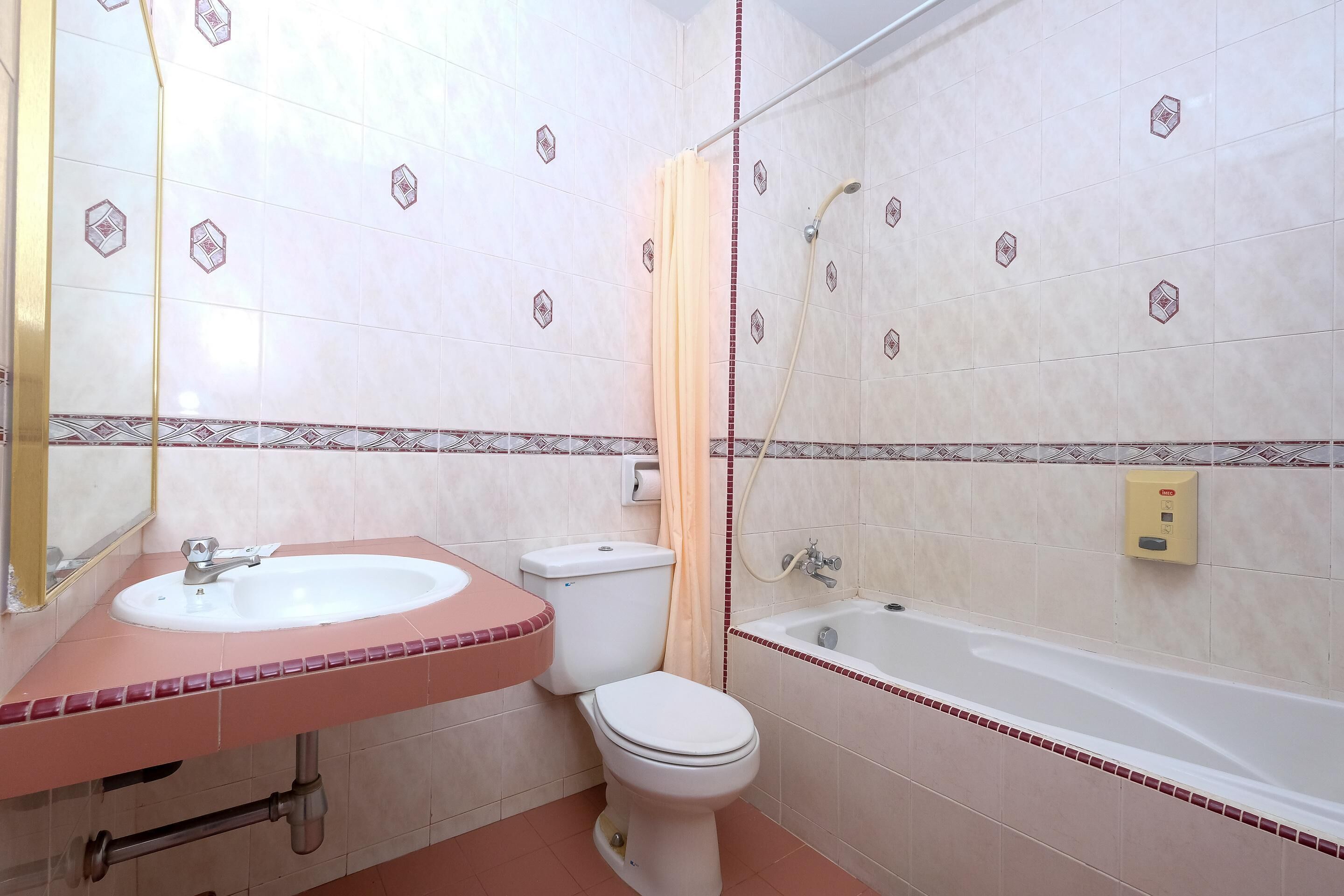 hair dryer, slippers, towels, shampoo